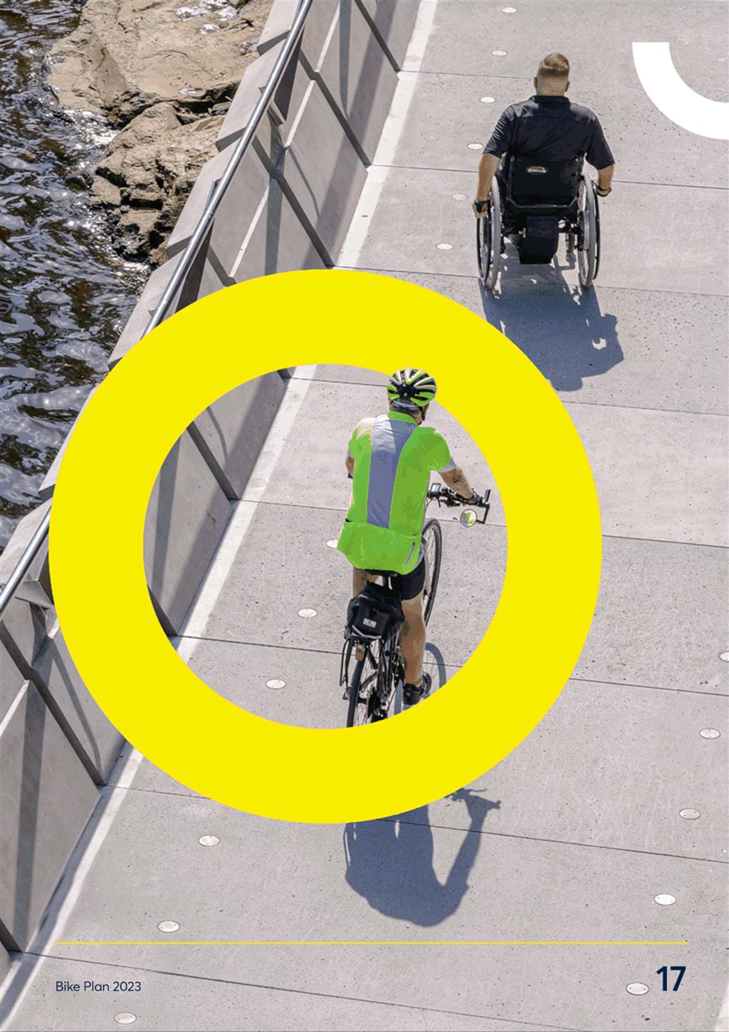 A person riding a bicycle on a bridge

Description automatically generated