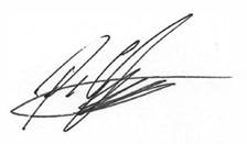 A signature on a white surface

Description automatically generated